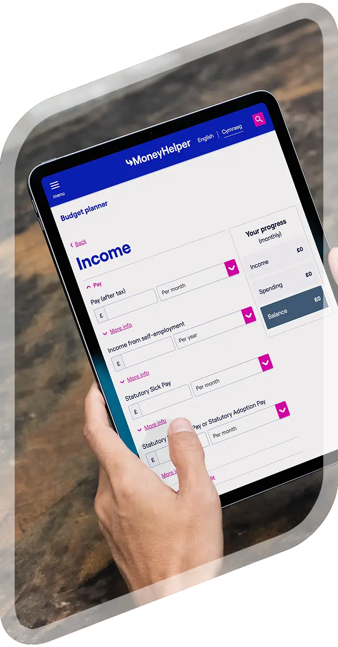 Person using MoneyHelper budget planner on tablet