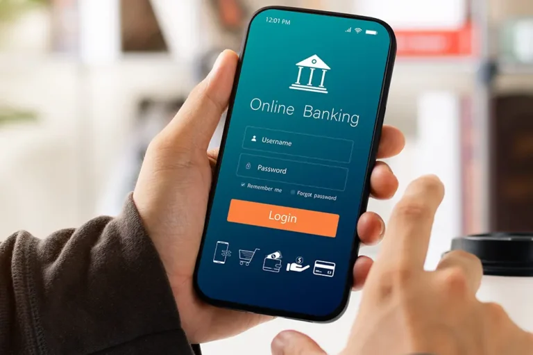 Person holding smartphone displaying online banking login screen